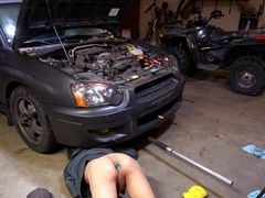 Slutty mechanic in the shop with a plug in his ass