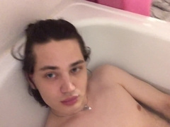 A young dude is toying with his man-meat in the douche