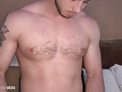 Hunk beats his meat in roadside motel