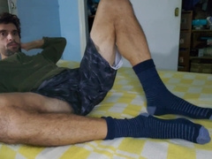 Defined stud with thick soles masturbating off in couch