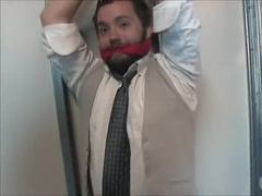 Young businessman tied up and gagged.