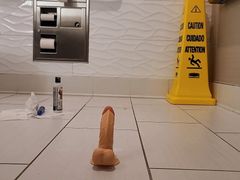 Naughty in a dirty bathroom floor
