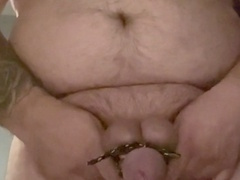 Erotic bondage session with nipple clamps intensifies pleasure for hung man