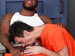 Skinny white man gets his ass fucked by a black dude in the prison