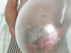 Pissing in an inflated condom