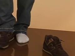 Attractive Asian gay strips naked to show his bare feet