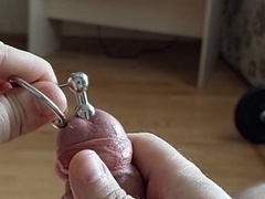Cum shot thru manhood urethral butt-plug with penis head ring (slow-motility cum-shot)