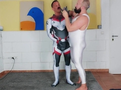 Muscle Man Tries On Spandex Cosplay Suit With The Help Of His Muscle Daddy