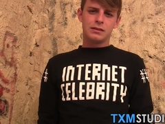 Blond twink fed with two dicks out in the open