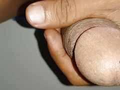 Young man enjoying jerking off cock without oil