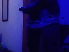 Black muscled guy masturbates in a blue room.