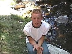 Forest twink masturbates near the stream