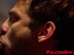 Two horny guys blowing each others dicks through glory hole