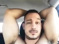 Sexy hairy man in a car