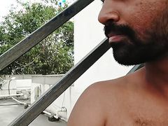 Getting naked in an open terrace and masturbating and cum