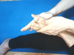 The dude gropes his soles with lubricant
