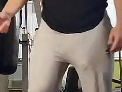 Guy at gym lifting weights huge bulge in grey trackies