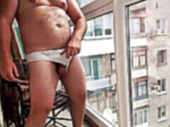 flashing off by the window smoking