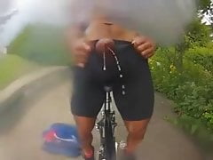 Cyclist public handsfree cum splashing his camera