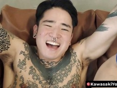 Asian stud Yoshi Kawasaki indulges in anal stretching with dildo play and fisting
