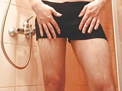 The guy washes in the shower and dances to the music