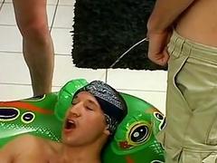Naughty jock enjoys being pissed on during a blowjob orgy