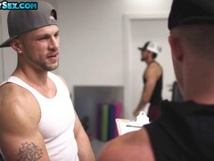 Tattooed top barebacks gym bottom in front of gym crowd