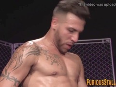 Muscular guy gets spitroasted in steamy threesome action with big dicks and rimjobs