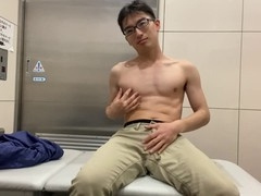 Japanese teenager masturbates naked in public toilet and gets a cumshot