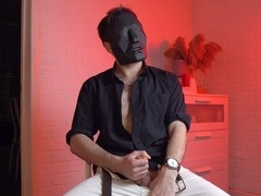 Masked hunk Noel Dero enjoys a solo session while watching raunchy scenes