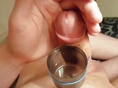 Young gay male rubs cock closeup for cumshots
