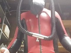 Latex catsuit and heavy rubber helmut