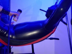 Electro on spanking bench with rubber play in sling and