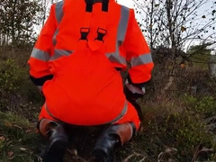 Worker In Hiviz Rain Gear And Rubber Boots