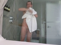 Nerd indulges in a private shower session, sensually explores his body with soapy fingers