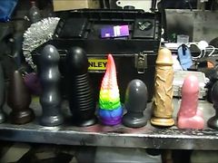 chubby mechanic trying out nine butt plugs