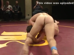 Naked studs wrestling on the floor