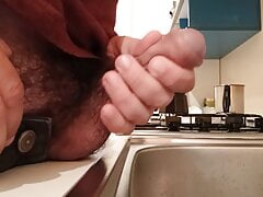 Pissing in the kitchen in the sink