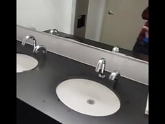 johnholmesjunior shooting cum load in busy mens bathroom in slow motion