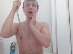 Magnificent nude boy takes a douche in front of the camera