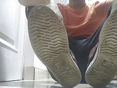 Red sneakers and sweaty socks after a long day