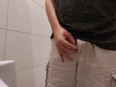 Compilation of men pissing at public urinals in restrooms