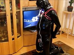 Rubber Gimp in the pillory