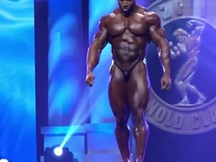 Massive BB Cedric McMillan posing on stage