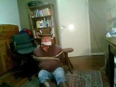 Cowboy In Dark Red Shirt Being Hold As Hostage