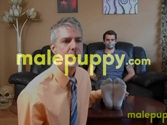 Professor Richard Lennox tickles the feet of his young student Kody Tracer