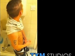 Amateur twink Mark Henley masturbating in the mens room