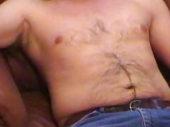 Long-haired dude with a furry stomach has got a giant boner