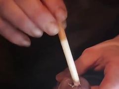 Cockhead Burning with Cigarettes Dare