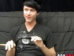 Young gay man jerks off his giant dick during an interview